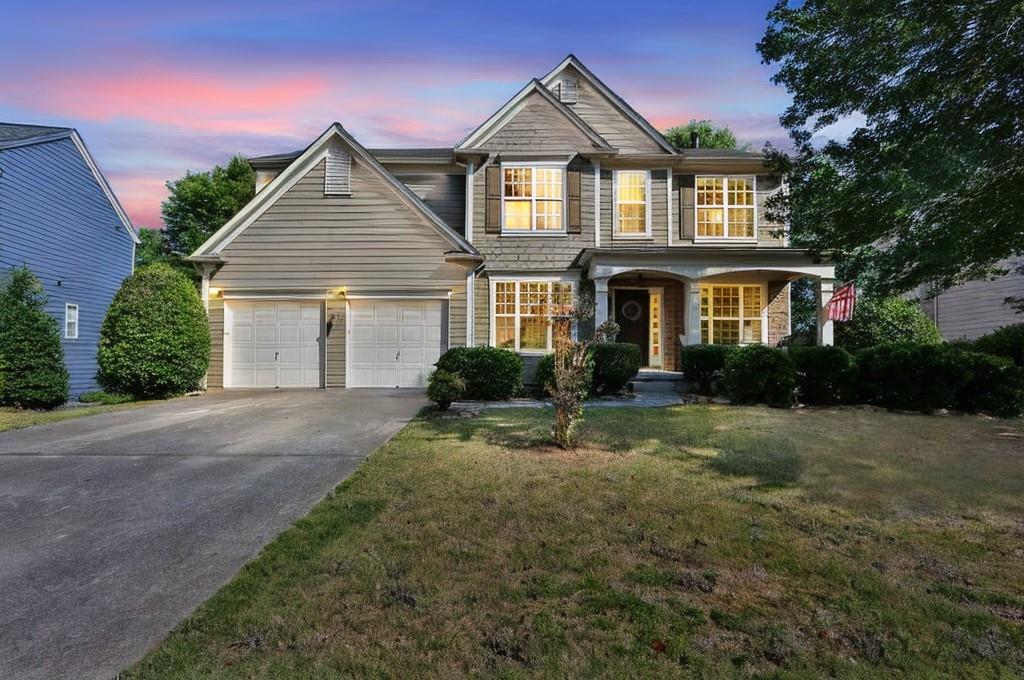 a front view of a house with a yard