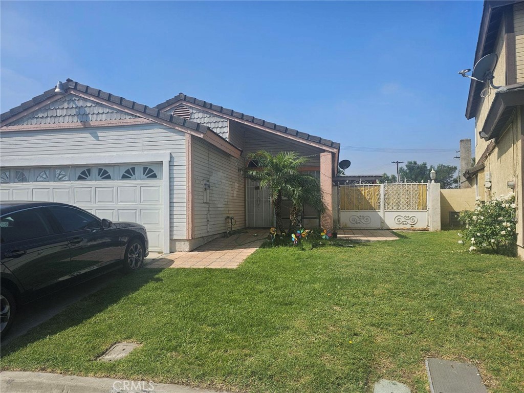 a view of a house with a back yard