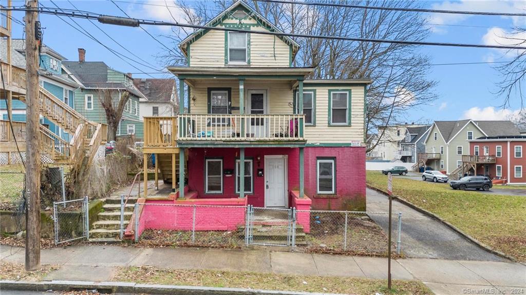 a front view of a house with street