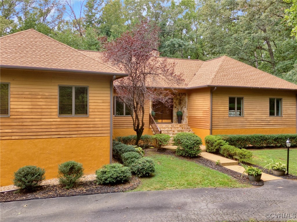 a front view of a house with garden