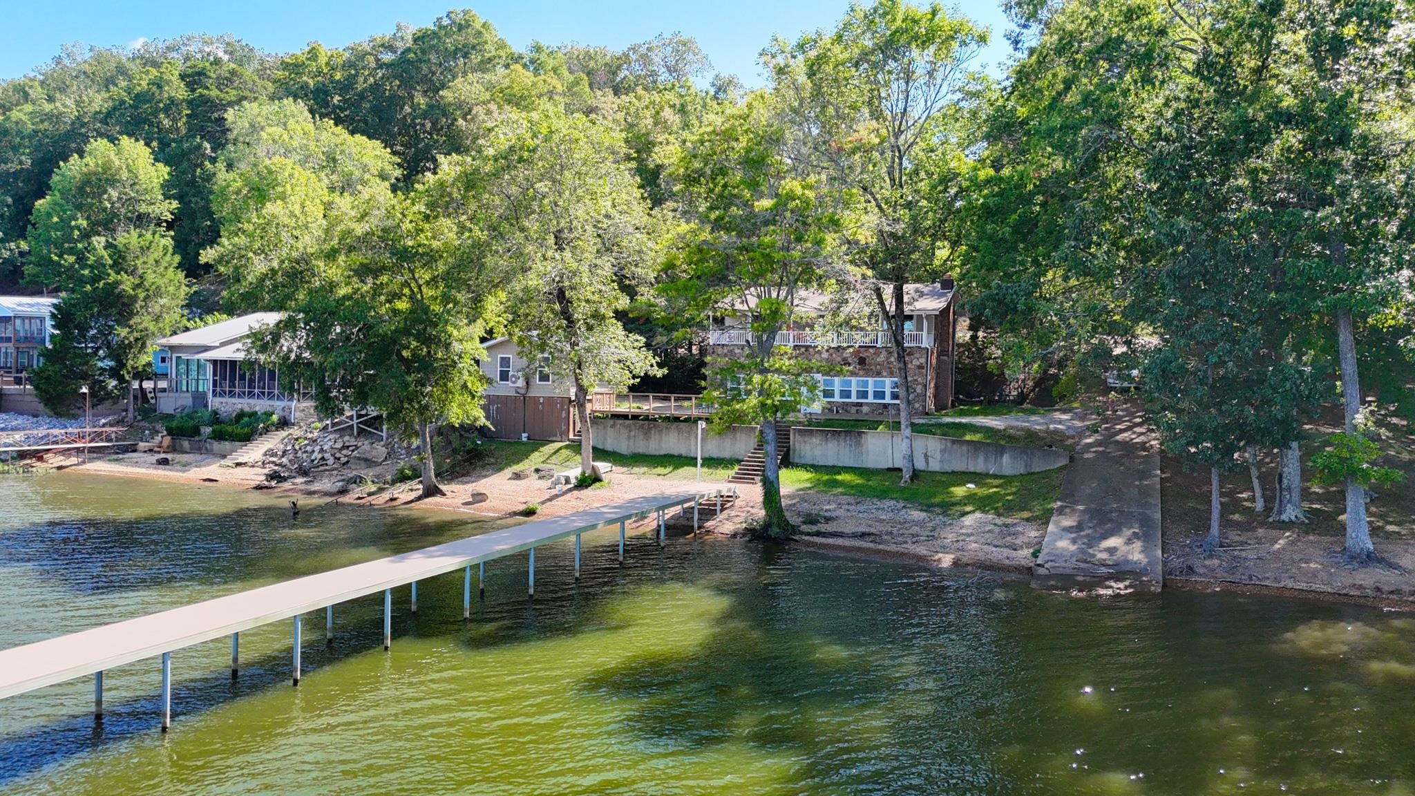 a view of house with swimming pool