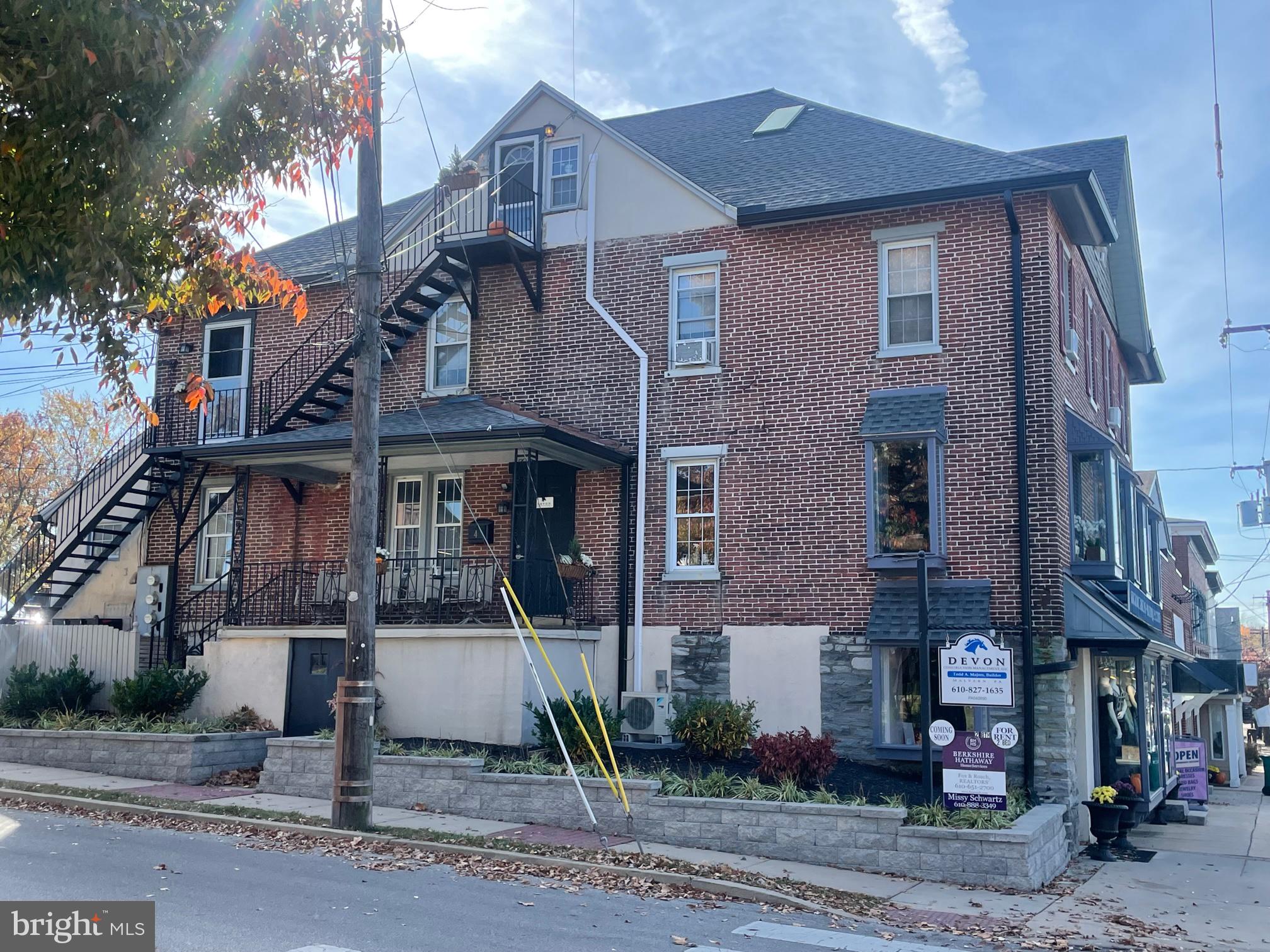 a front view of a houses on the street