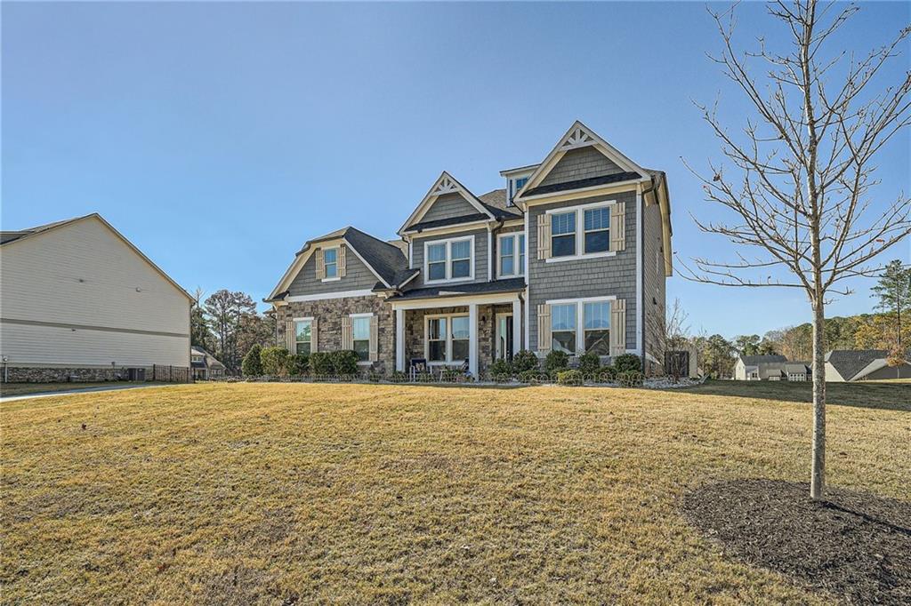 a front view of a house with a yard