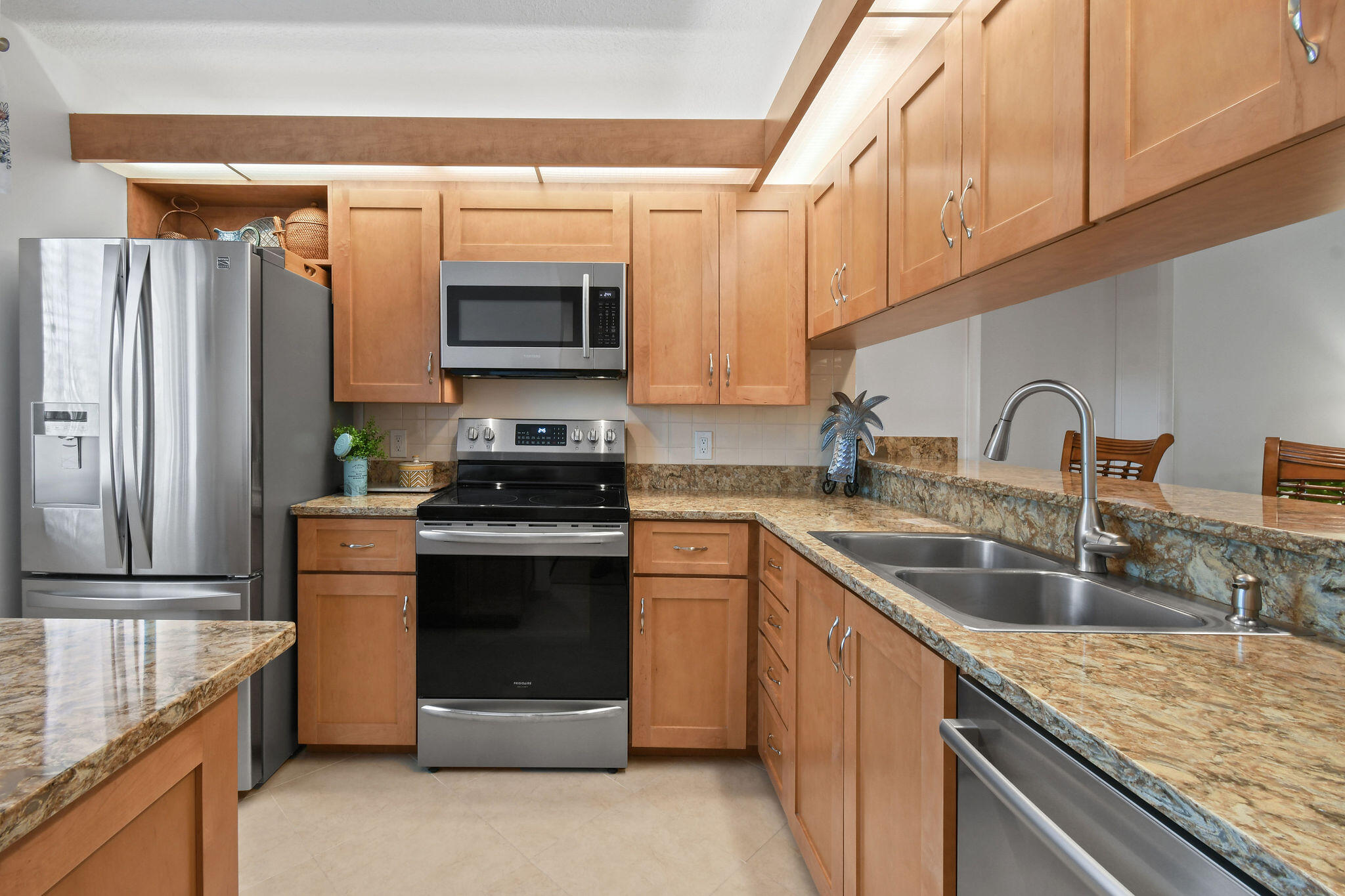 a kitchen with a sink stove and refrigerator