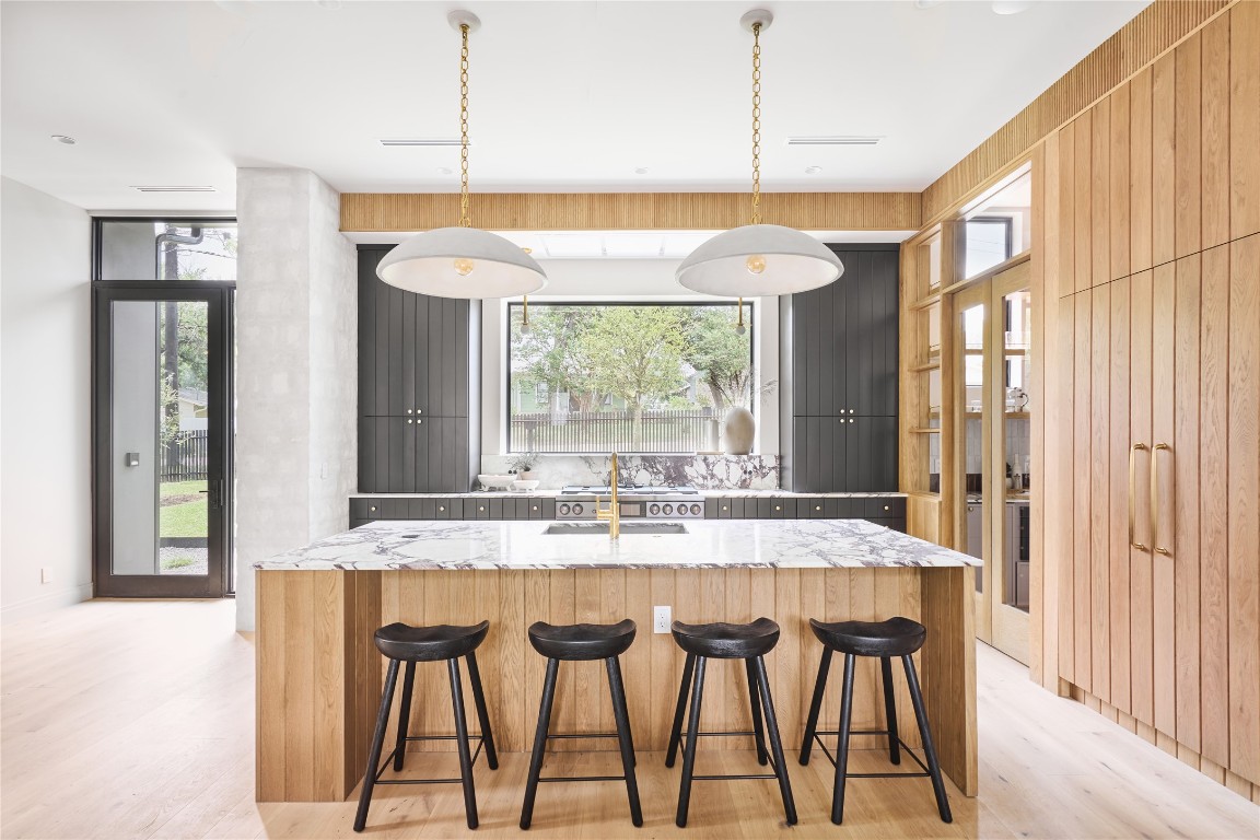 a dining room with a table and chairs