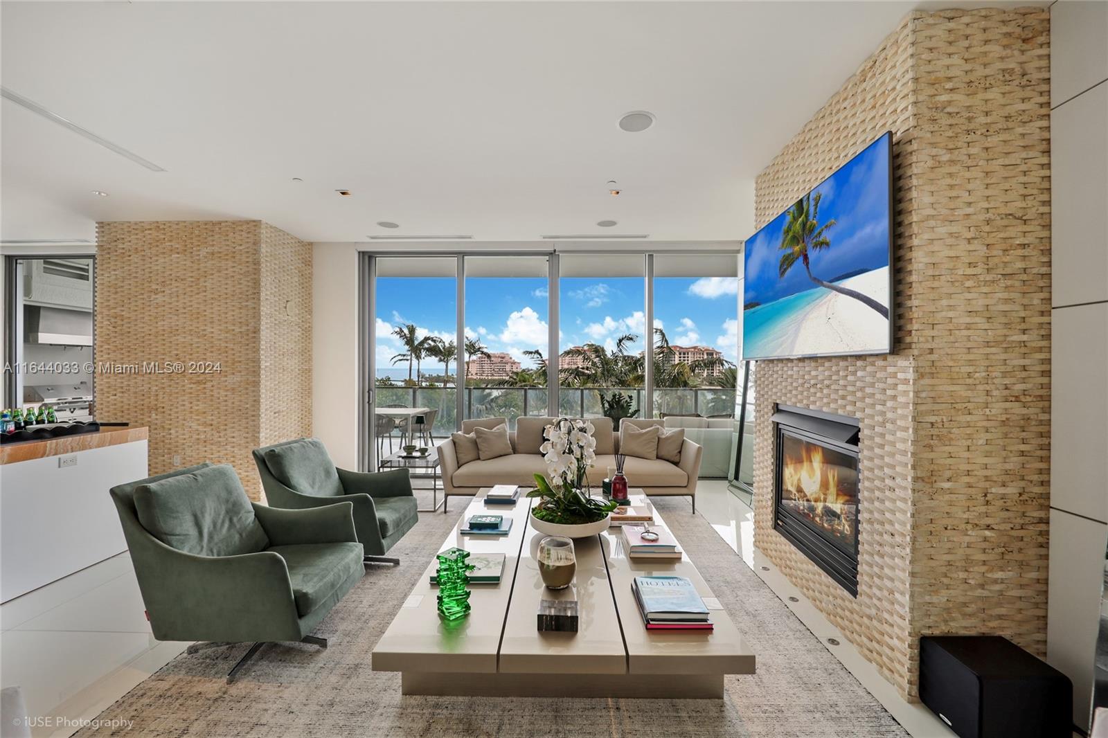 a living room with furniture fireplace and flat screen tv