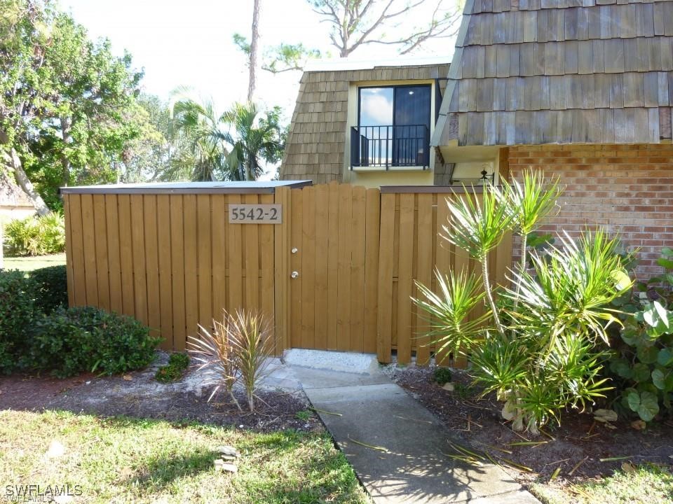 a view of a backyard with plants