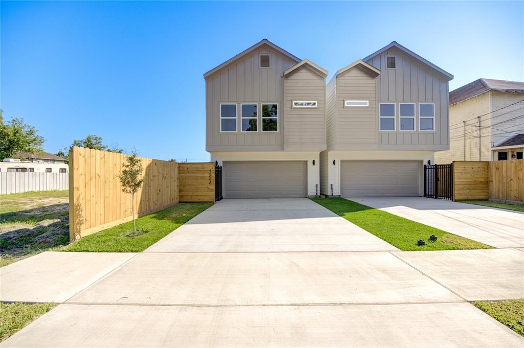 a front view of a house with a garage