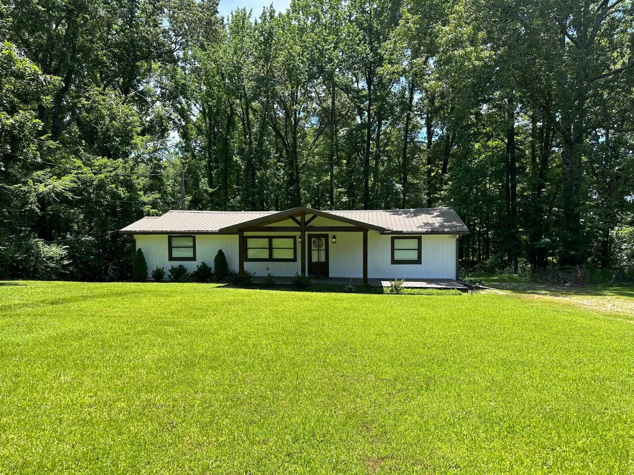 Ranch-style home with a front lawn