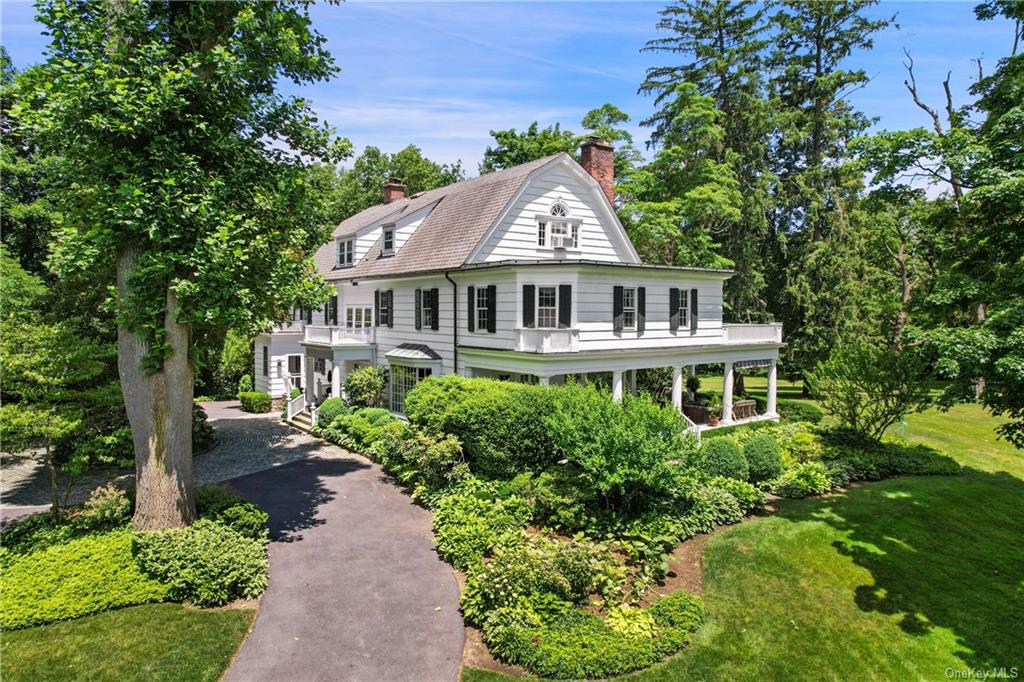 Magical park like estate with private drive past rolling lawns and circular driveway leads you to this stunning 1907 remodeled estate that has been loved by the same family for decades.