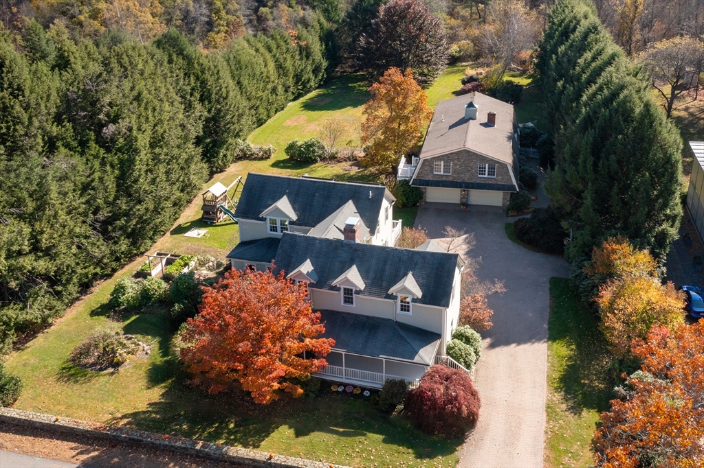 an aerial view of house with yard