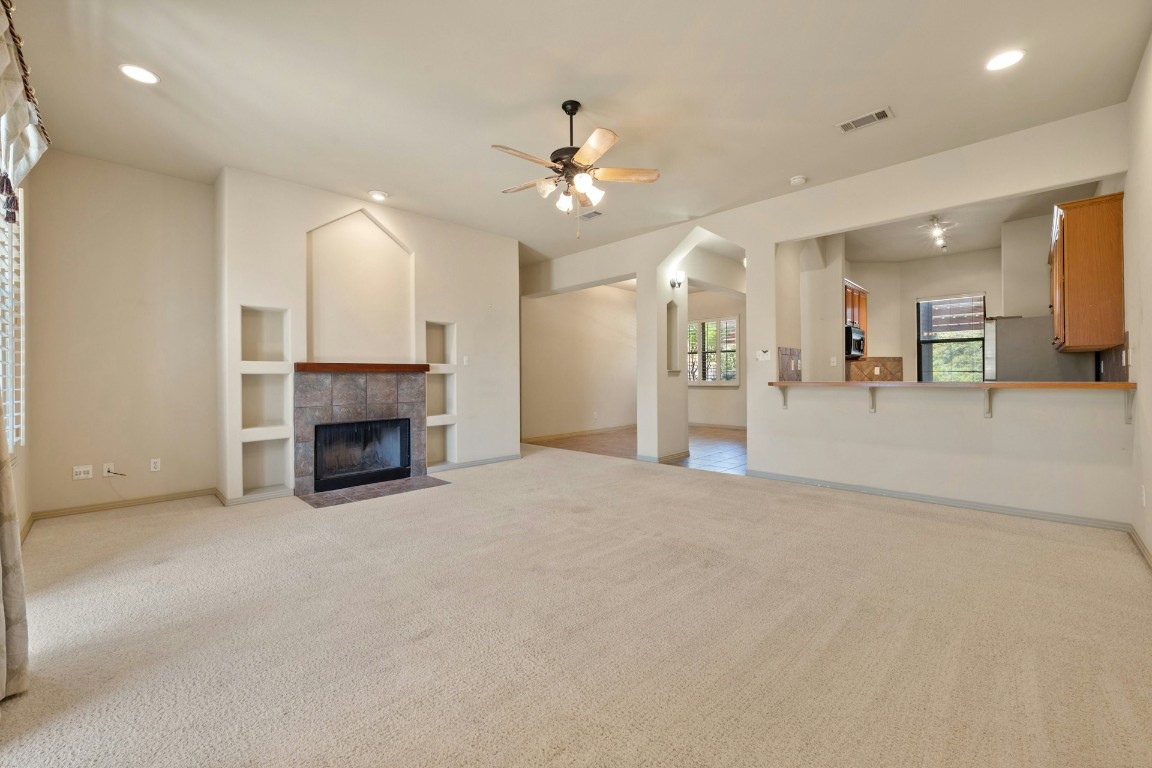 a view of an empty room with a fireplace