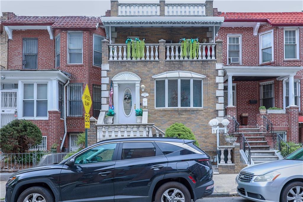 a front view of a house with parking space