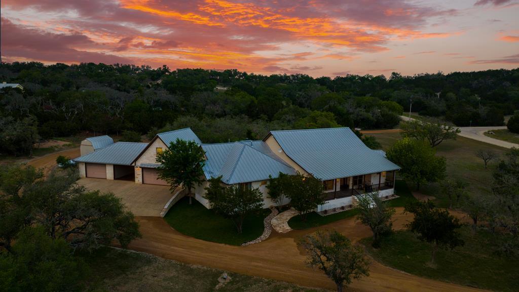 an aerial view of a house with mountain view