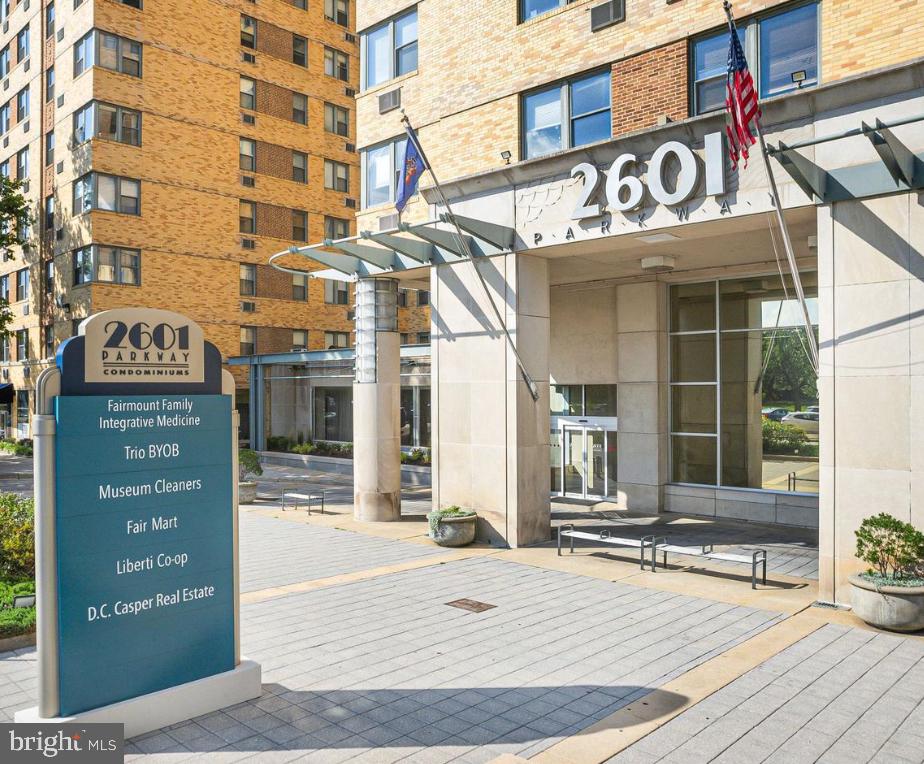 a view of a building with a street sign