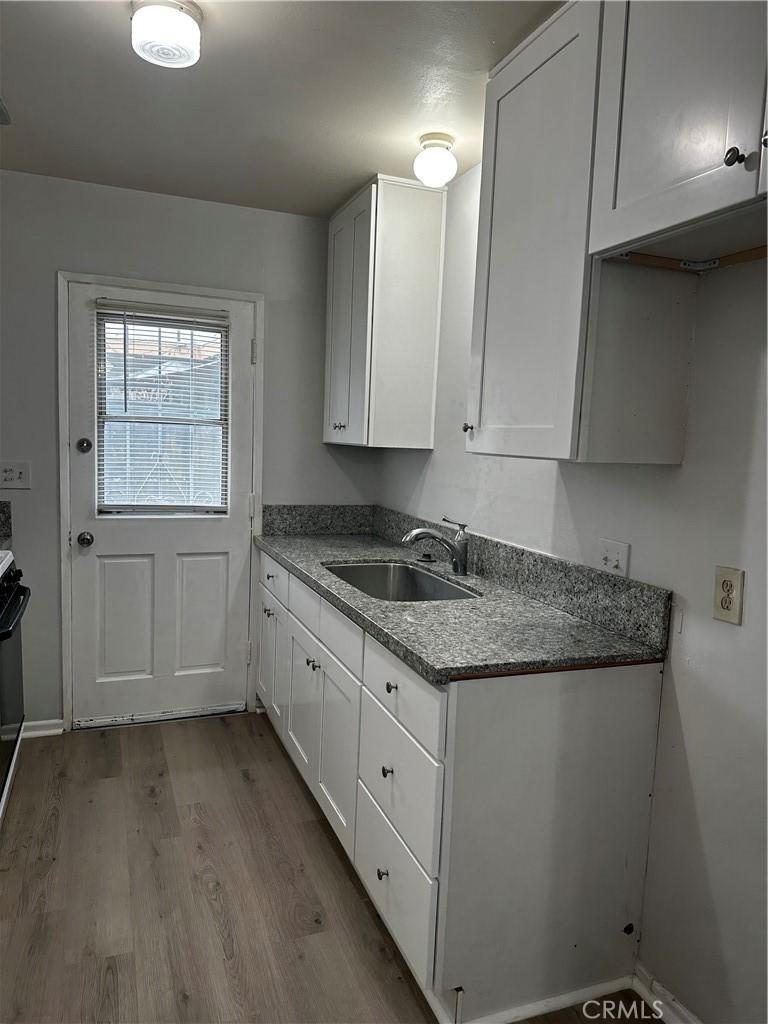 a kitchen with granite countertop white cabinets and a granite counter tops