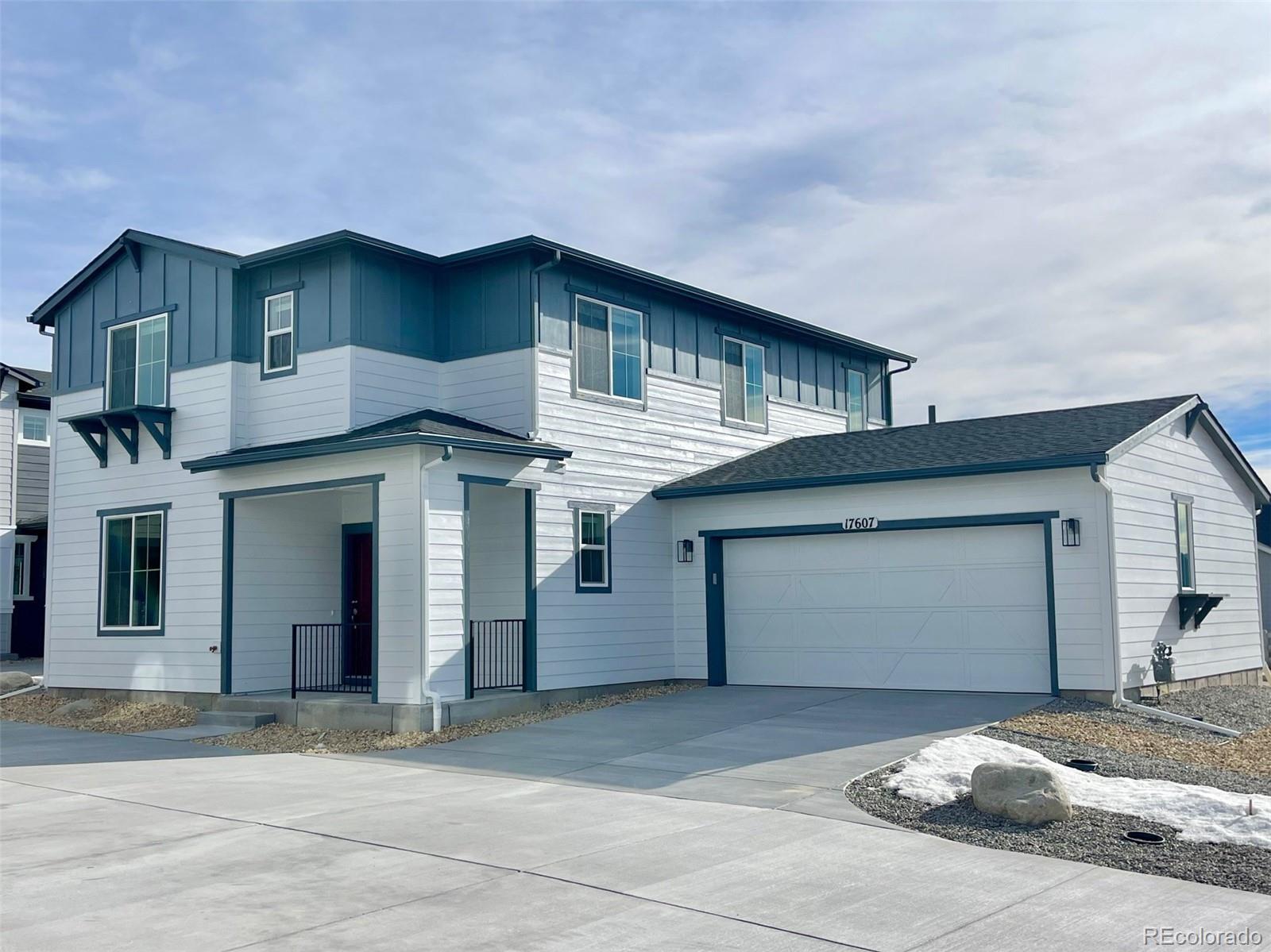 a front view of a house with a garage