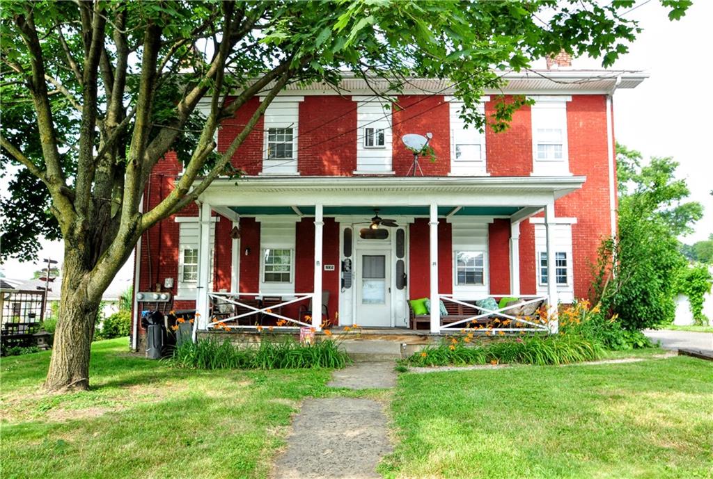 front view of a house with a yard