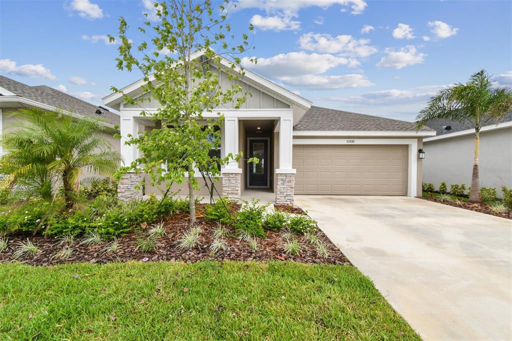 front view of a house with a yard