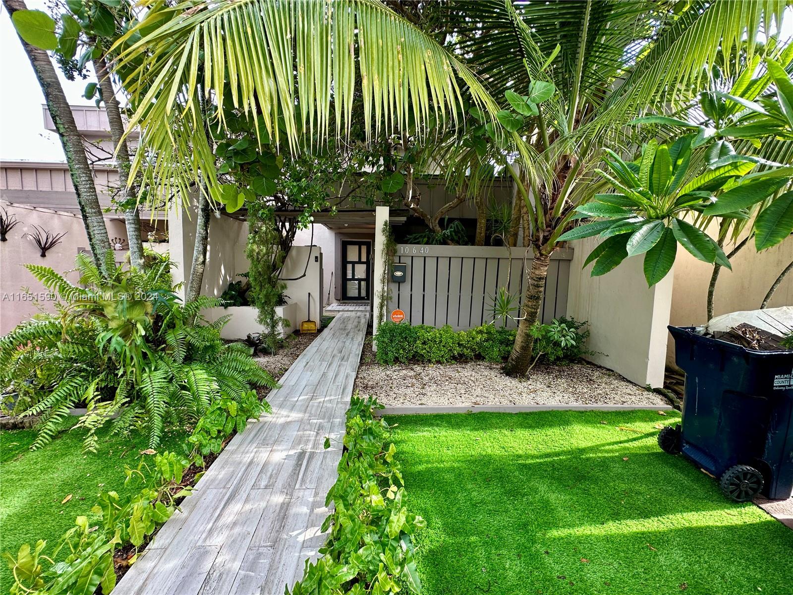 a view of a backyard with plants