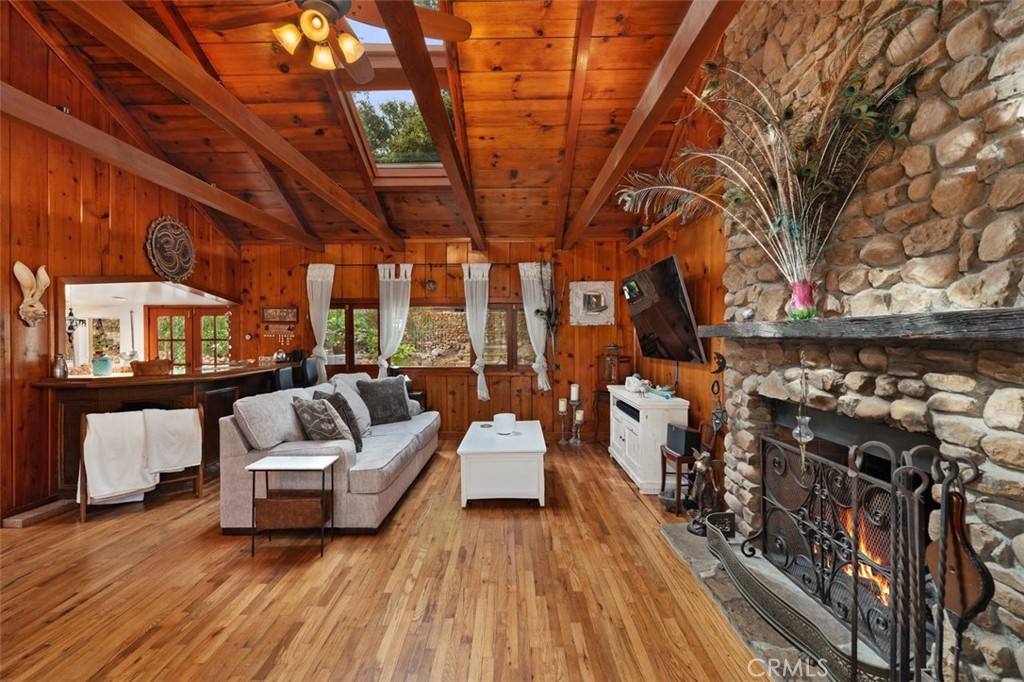 a view of living room with furniture and wooden floor