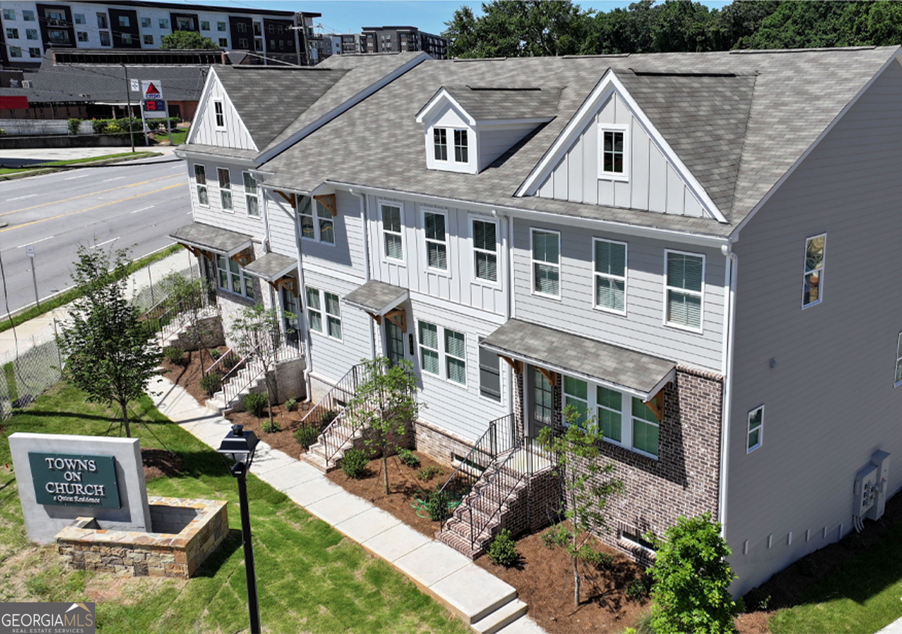 a aerial view of a house with a yard