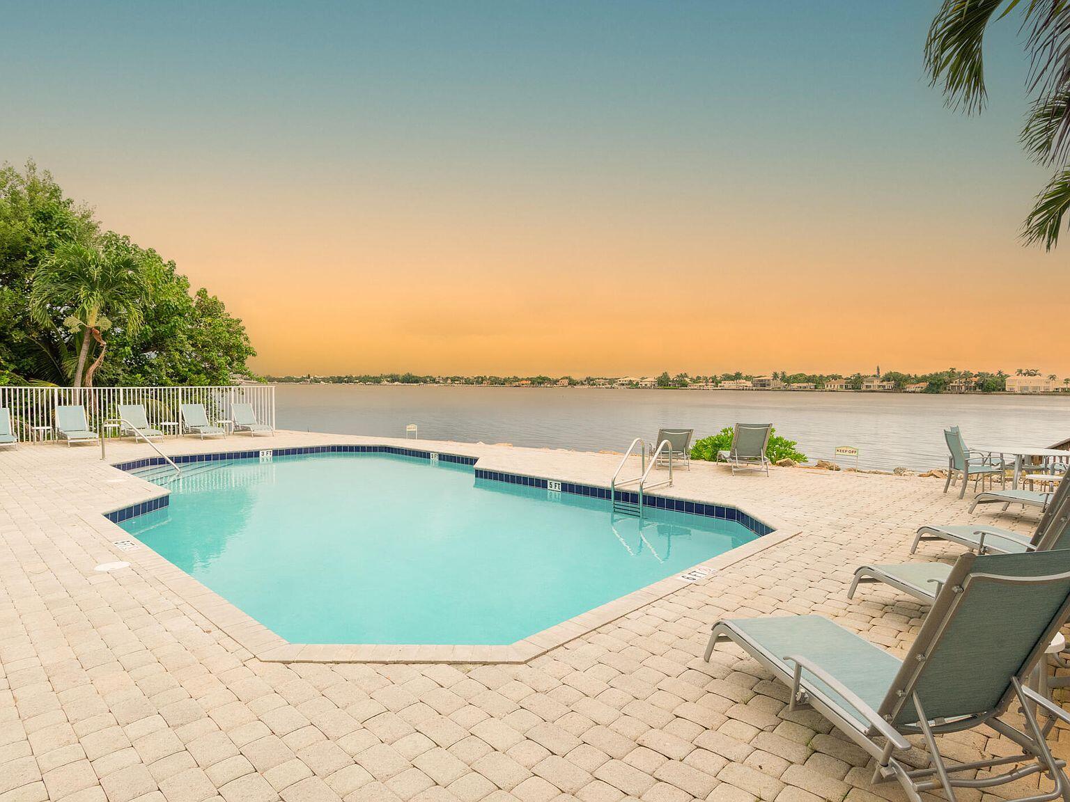 a view of a swimming pool with an ocean view