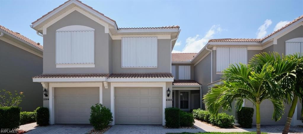 a front view of a house with a garage