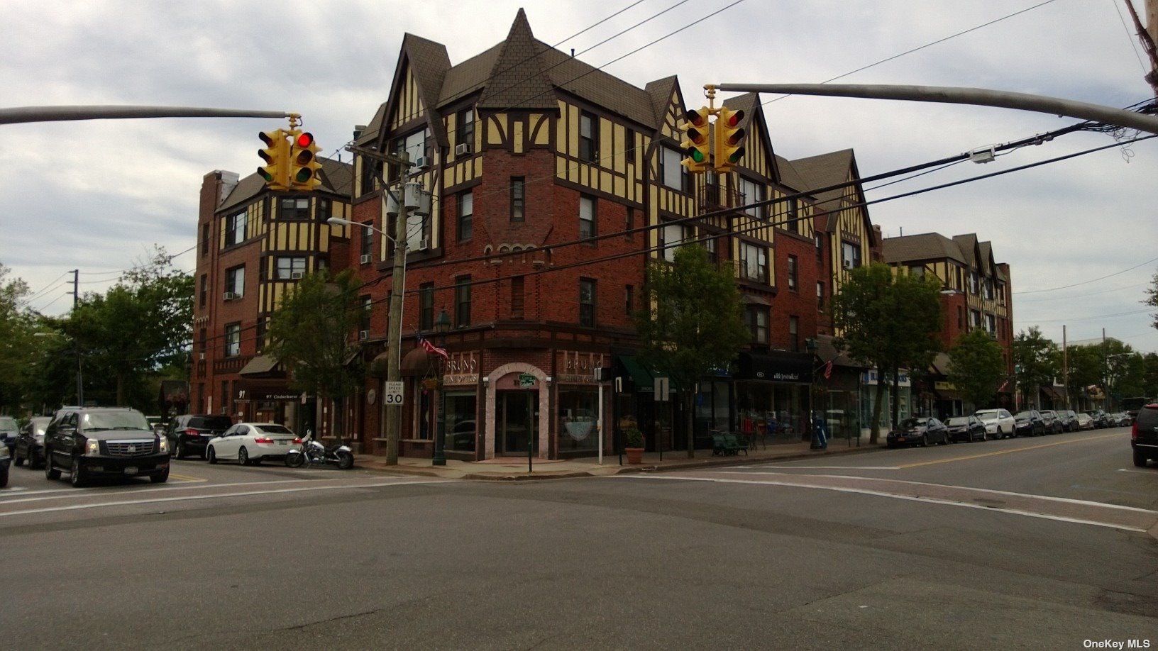 a view of a street with a building in the background