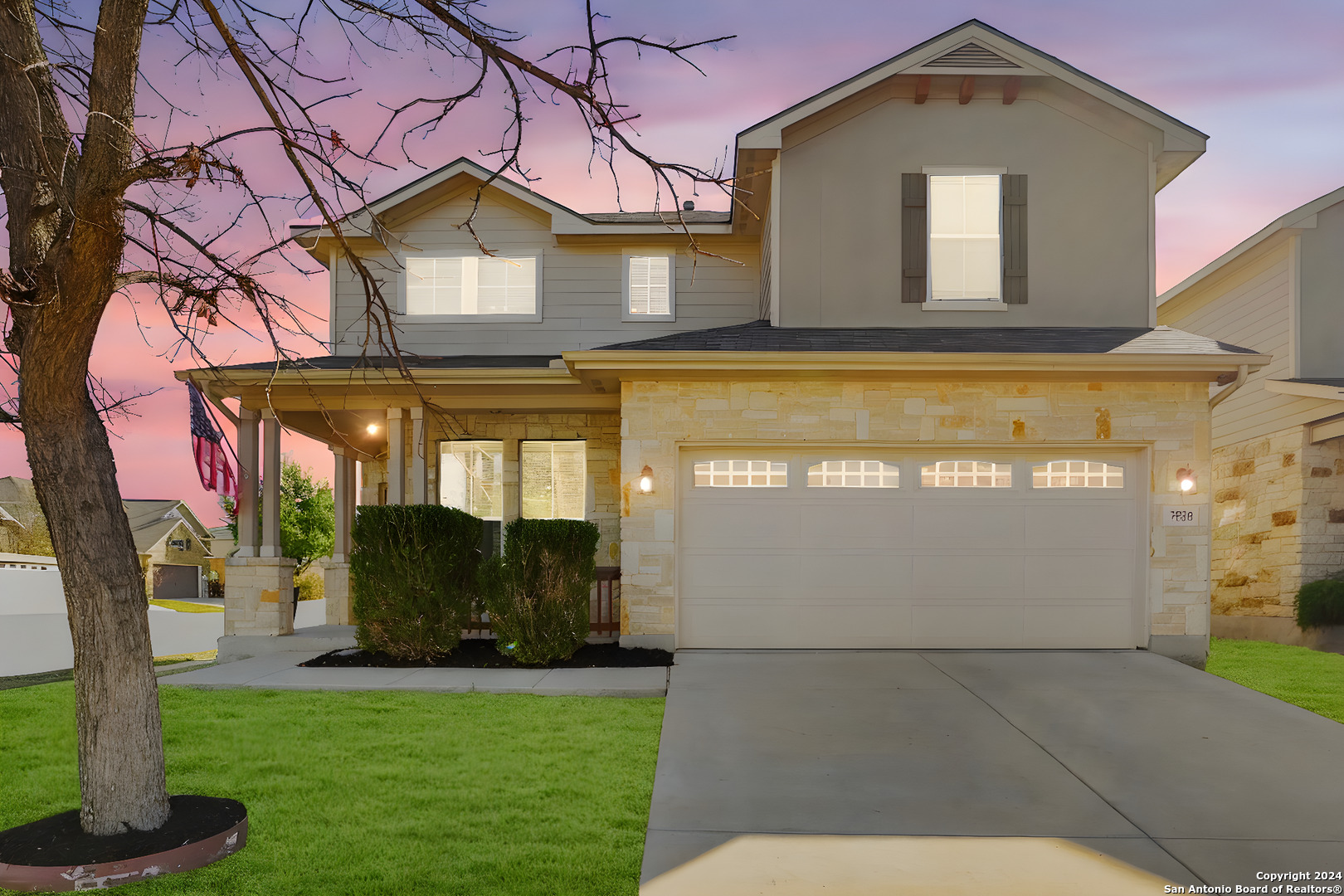 a front view of a house with a yard