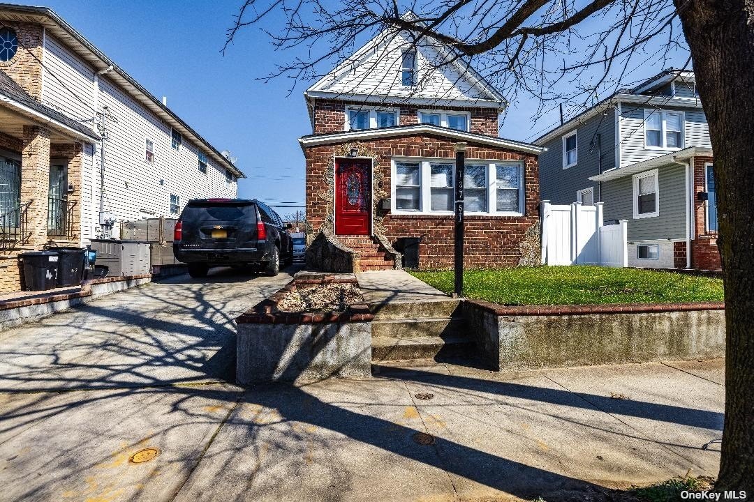 a view of a building with car parked