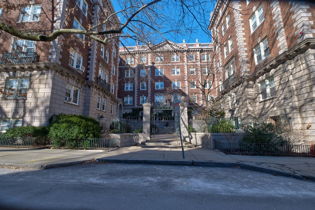 a view of a building with a yard