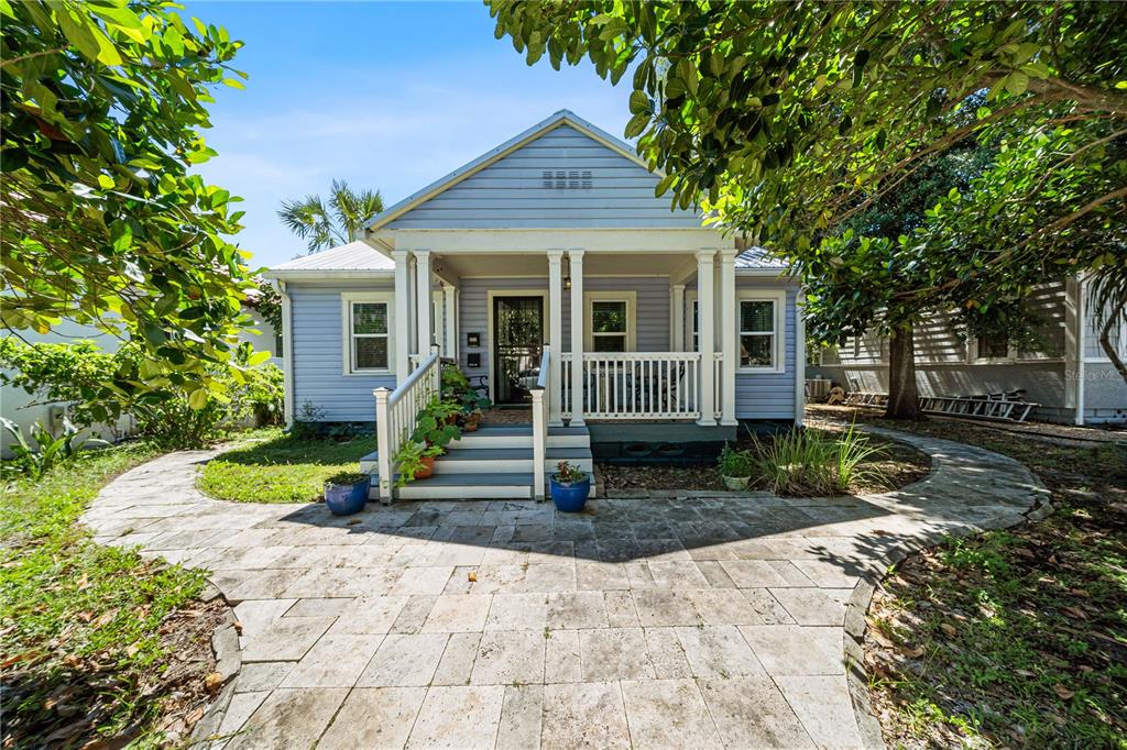 a front view of a house with garden