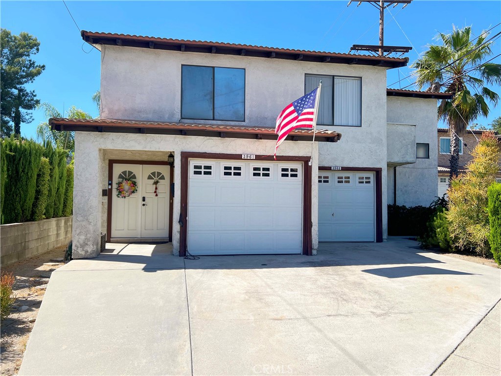 a front view of a house with a garage