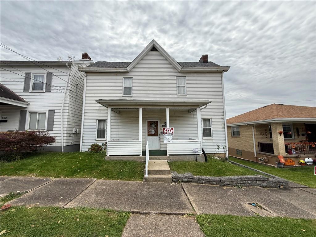 a front view of a house with a yard