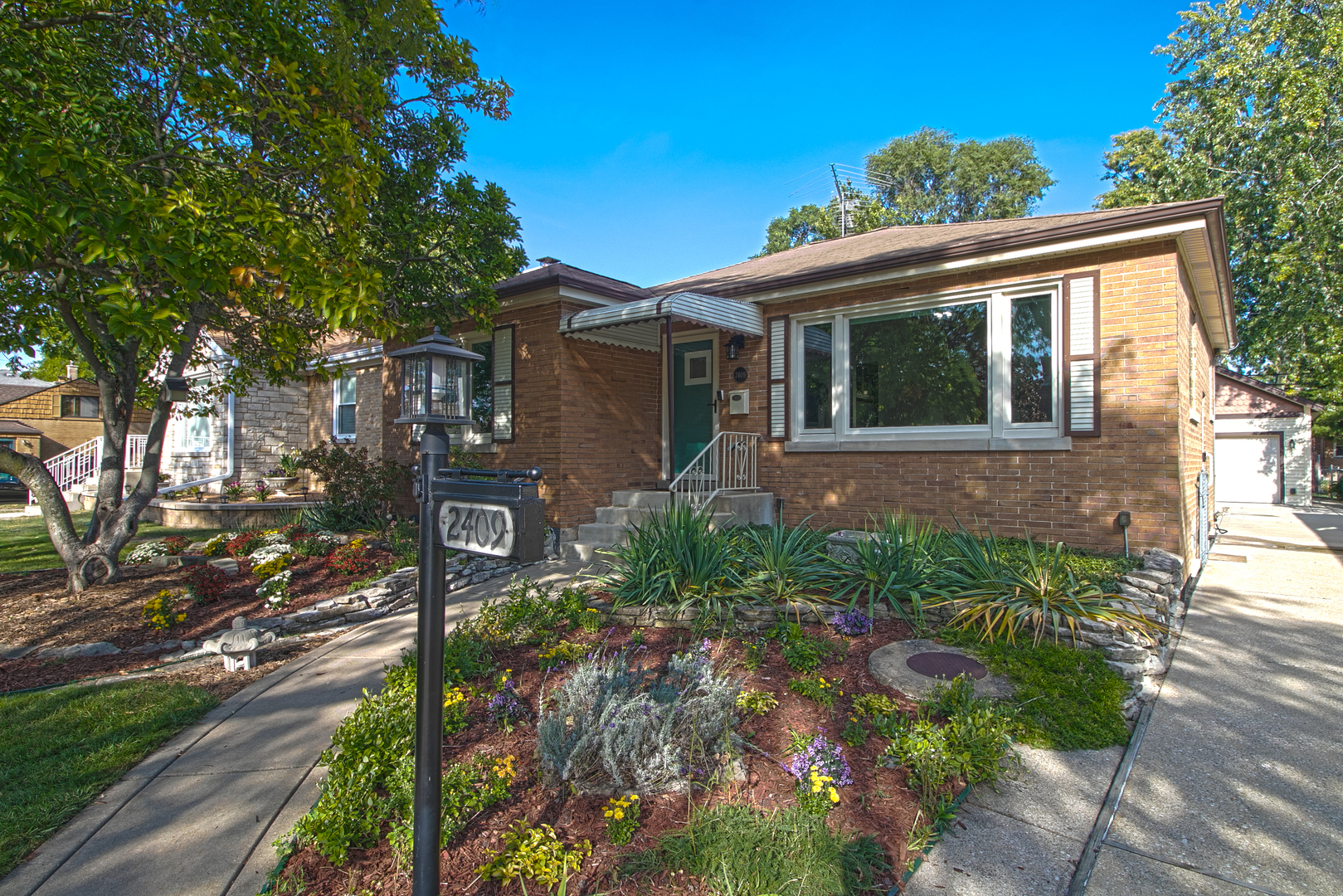 a front view of a house with garden