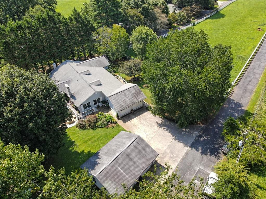 an aerial view of a house with a garden