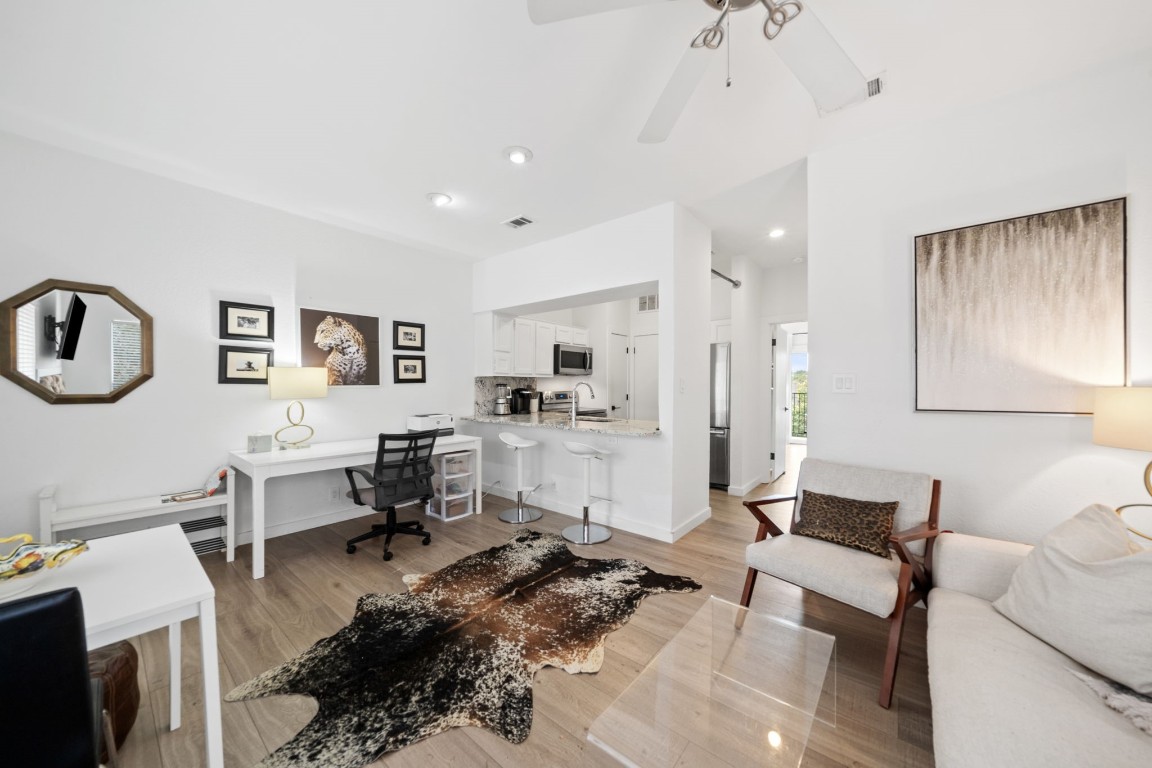 a living room with furniture and a table