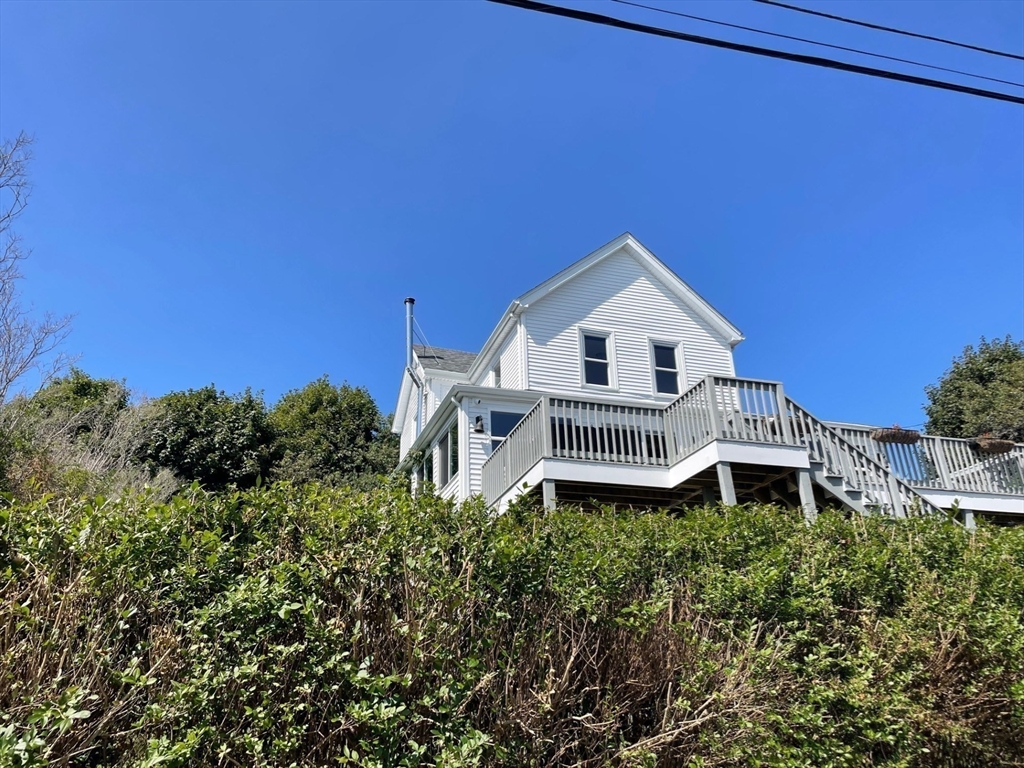 a house with trees in the background