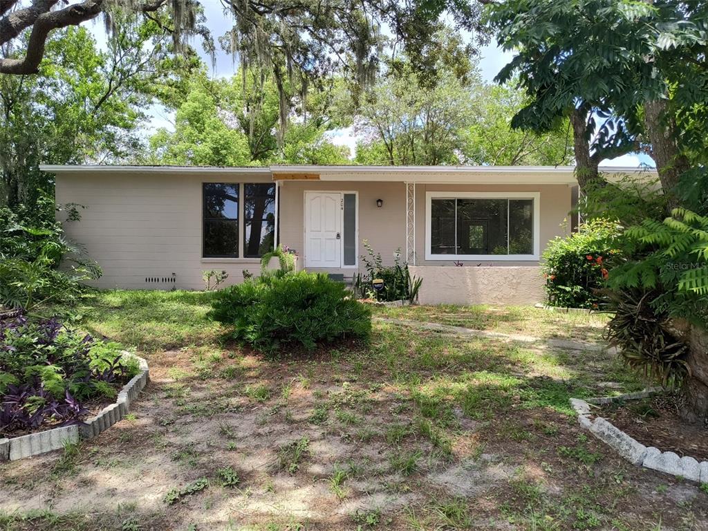 front view of a house with a yard