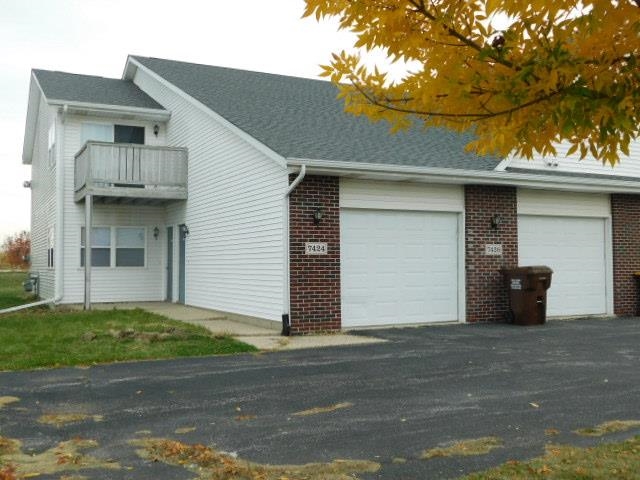 a view of a house with a garage