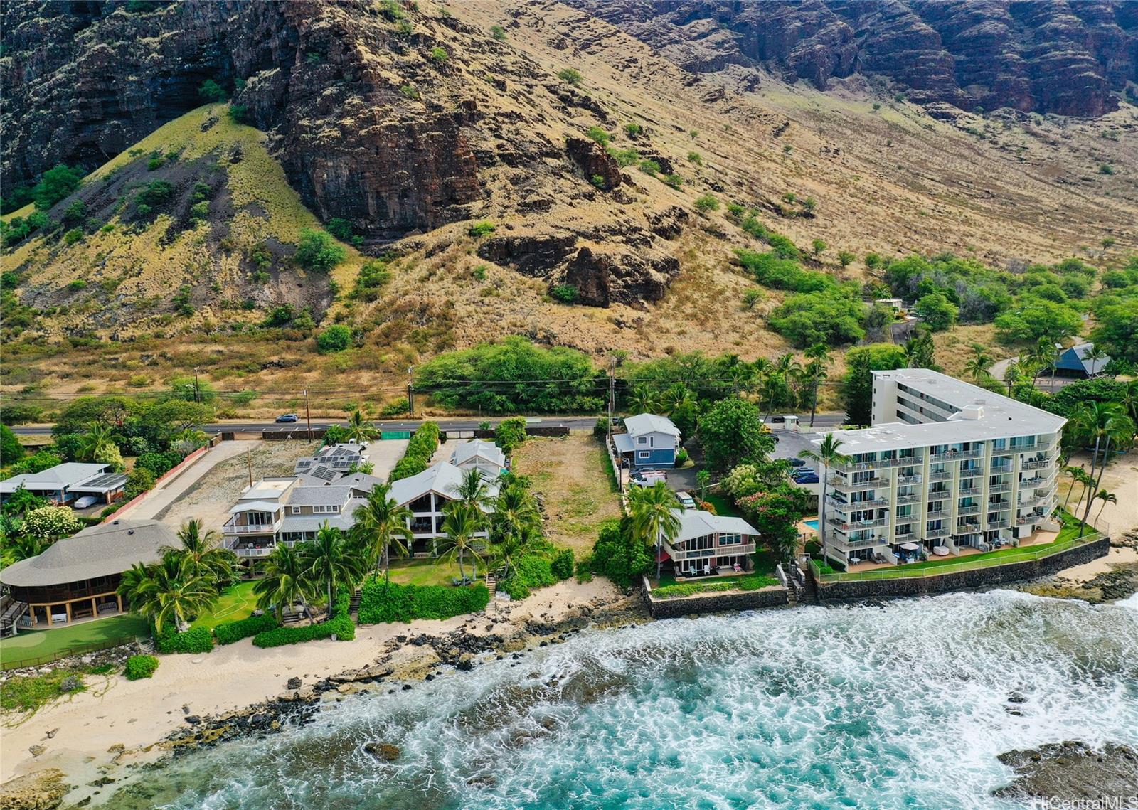 This ocean front, level lot overlooks a world class surfing wave at Makaha Beach