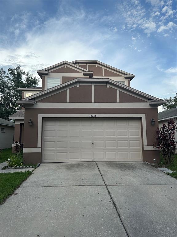 a front view of a house with yard