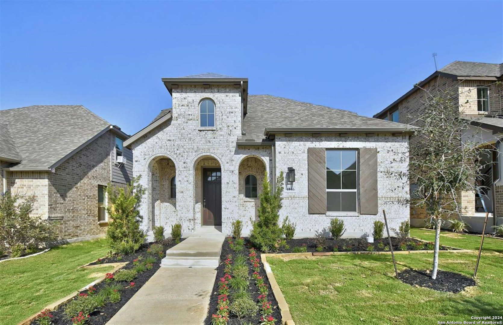 a front view of a house with a yard