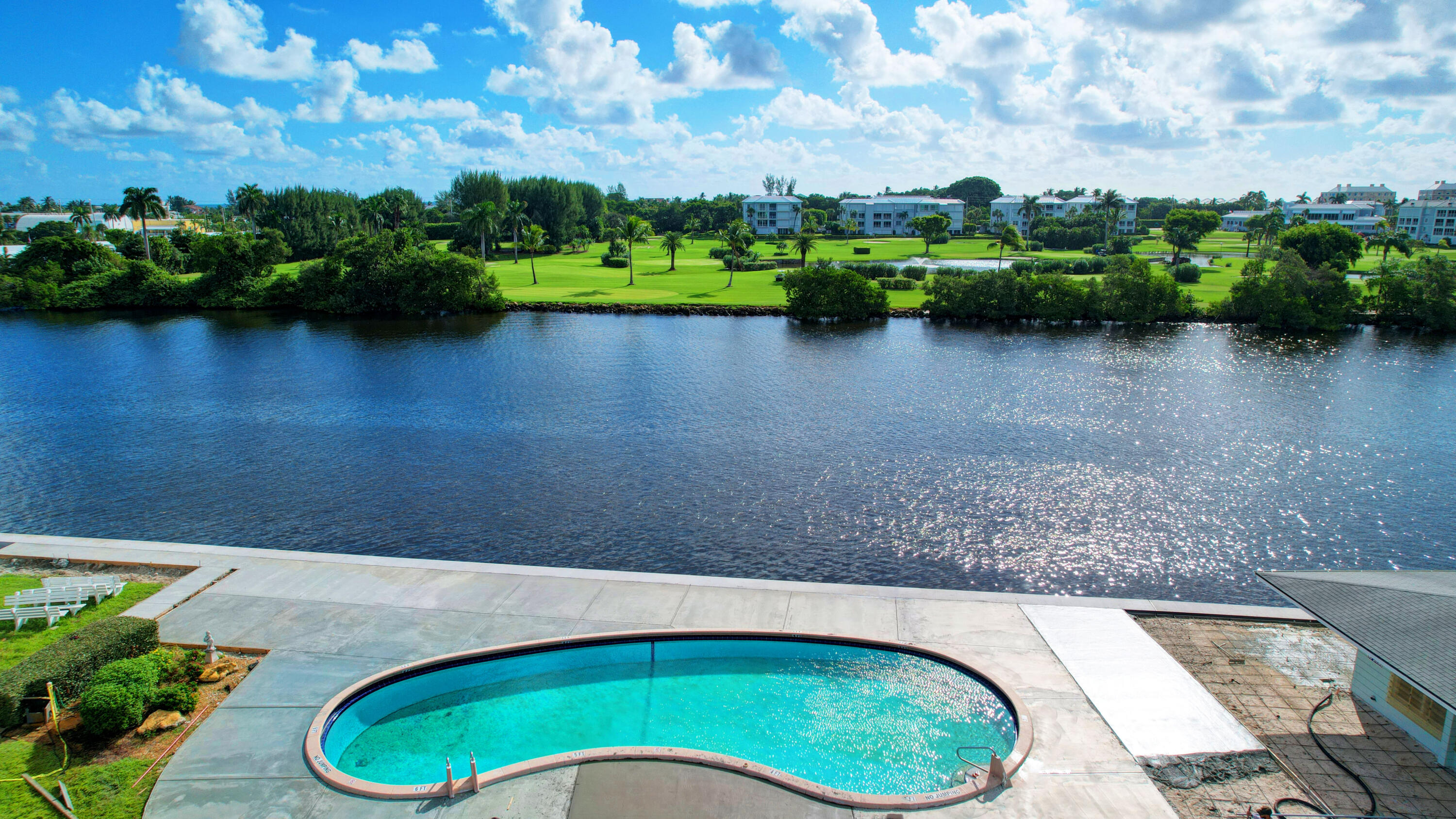 a view of swimming pool outdoor outdoor seating and lake