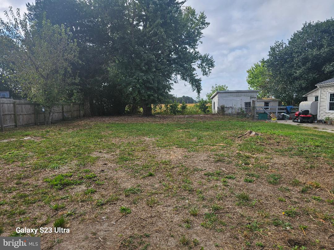 a view of a big yard with a house