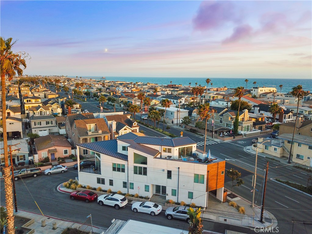 an aerial view of residential houses with city street