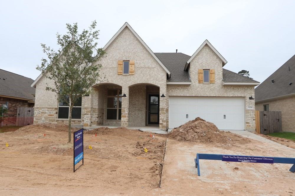 a front view of a house with garage