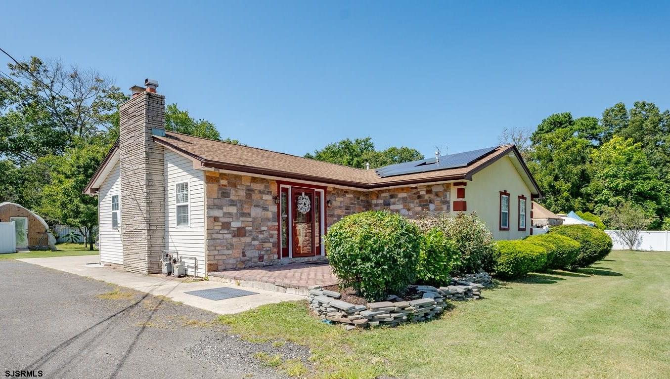 front view of a house with a yard