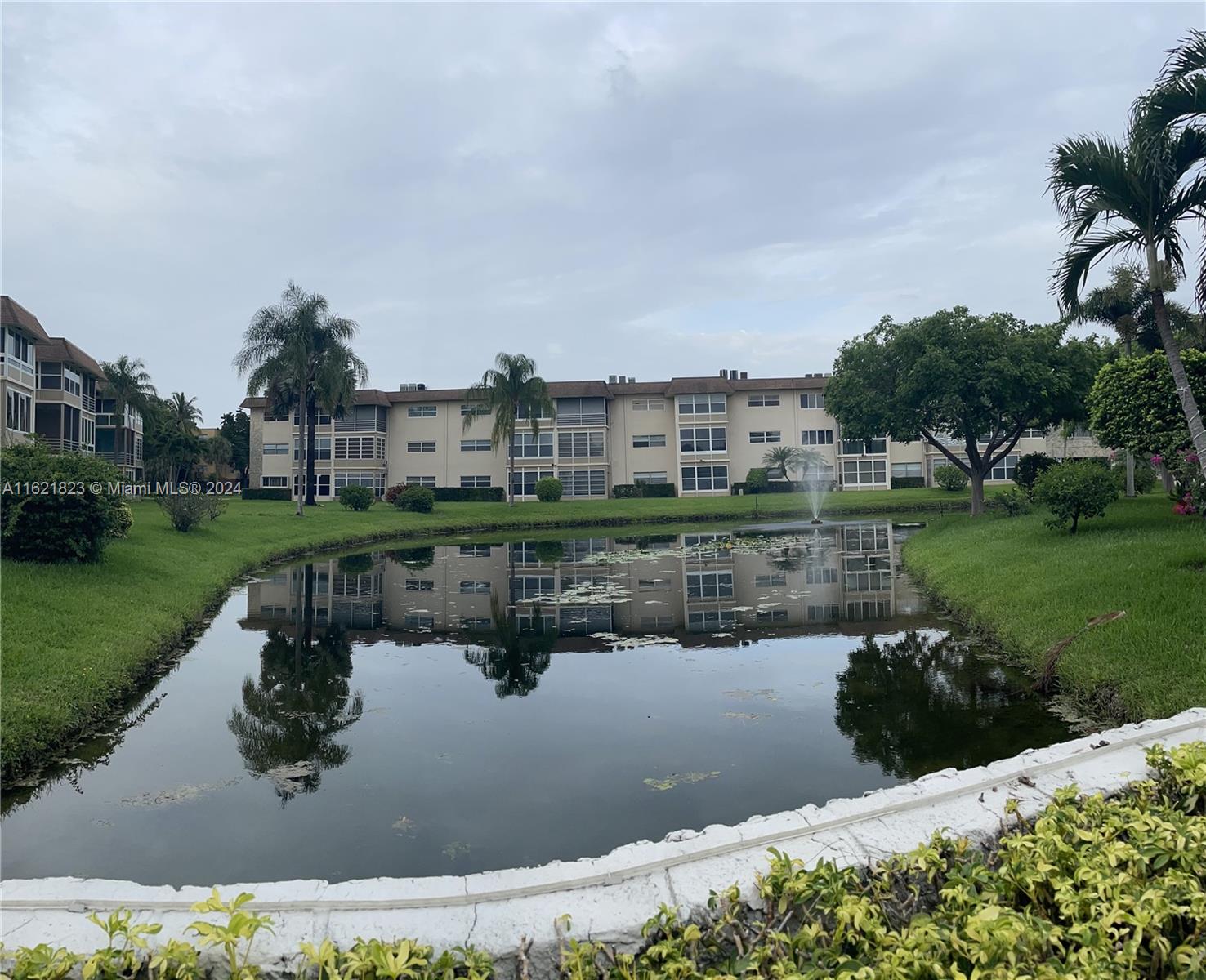 a view of a lake with a house in the background